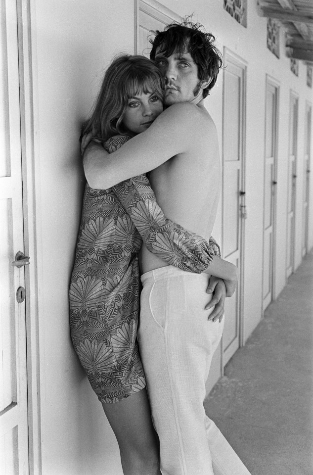 Black and white photo of Jean Shrimpton and Terence Stamp embracing.
