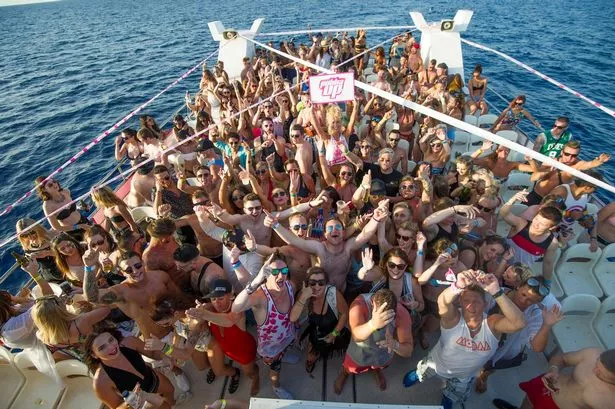 A crowded boat party at sea in Ibiza