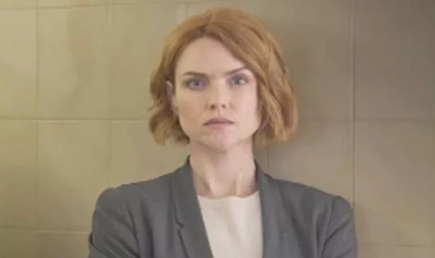 A woman looks serious