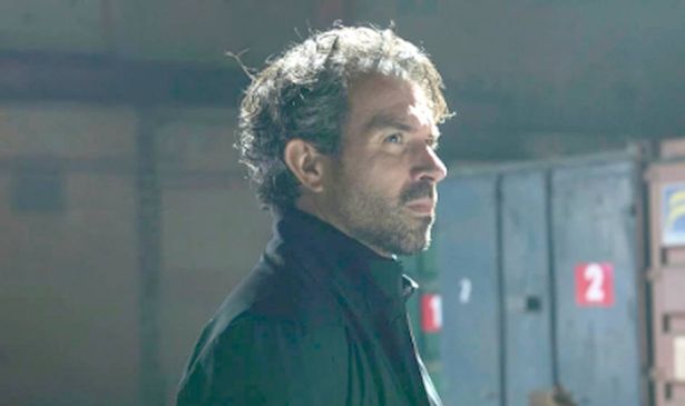 A man stands in a warehouse
