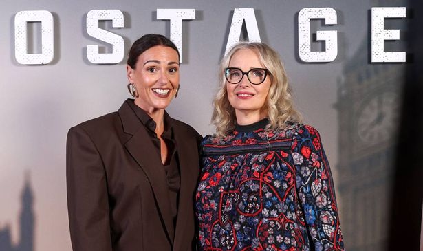 Two women stand together