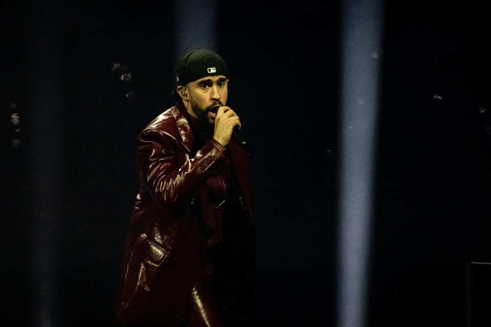 Bad Bunny performing on stage.