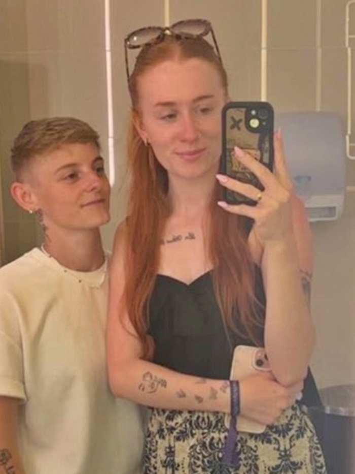 Photo of a couple taking a selfie.