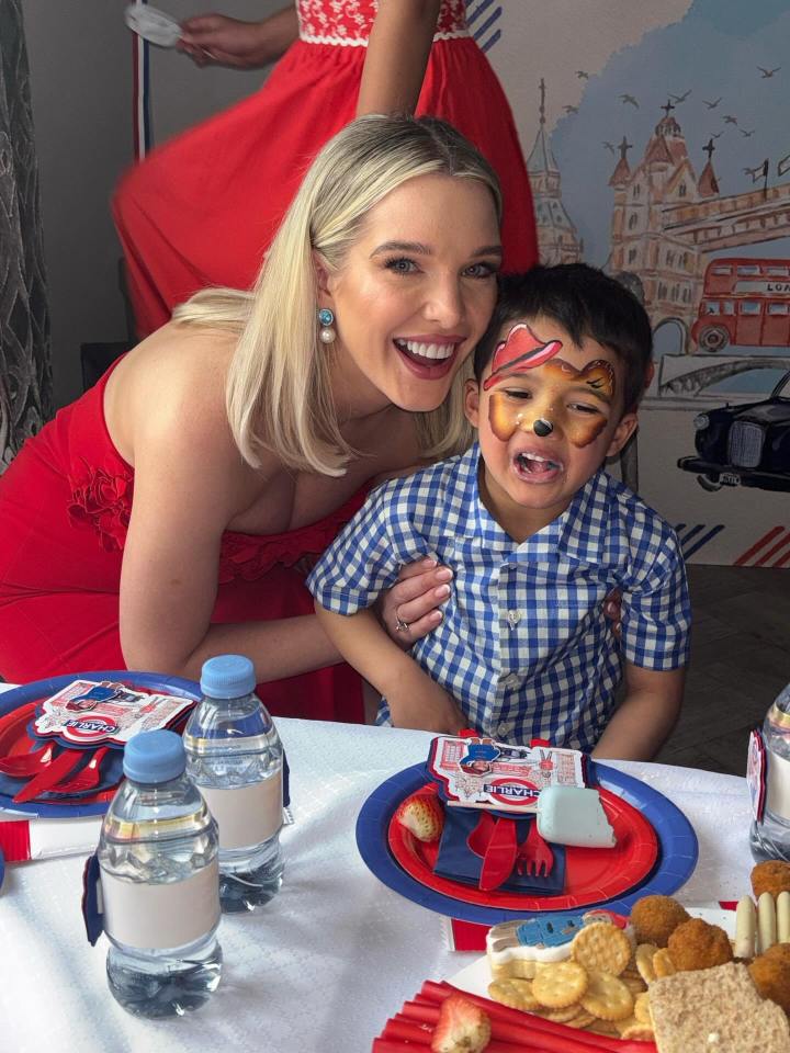 Woman and child with face paint at a party.