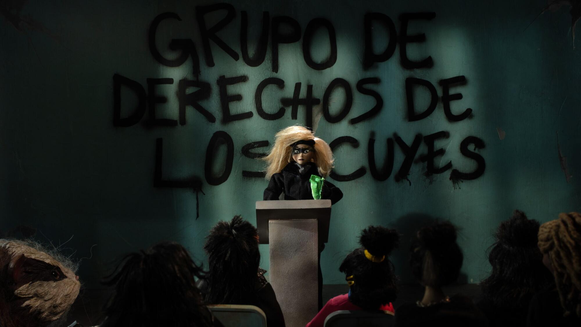 In this scene, Marioneta leads a "guinea pig rights group."