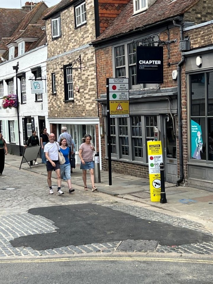 Tarmac repair on a cobblestone street in Canterbury, Kent.