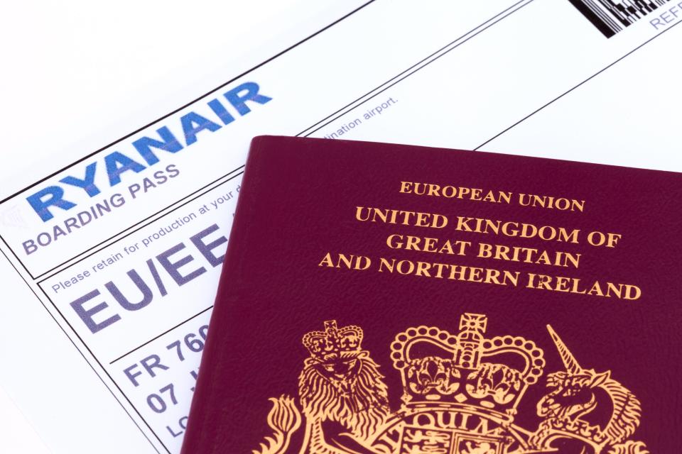 UK passport and Ryanair boarding pass.
