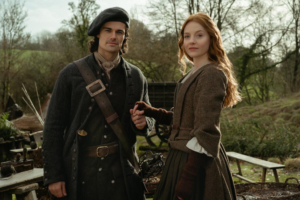 A man in attire and a woman in