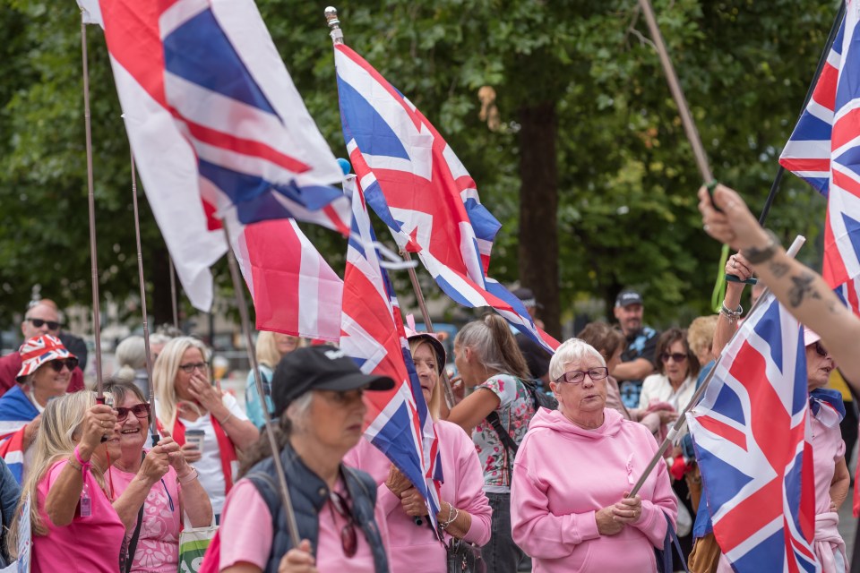 Protestors waving British flags.