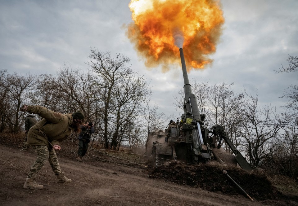 Ukrainian servicewoman firing a 2S7 Pion self-propelled gun.