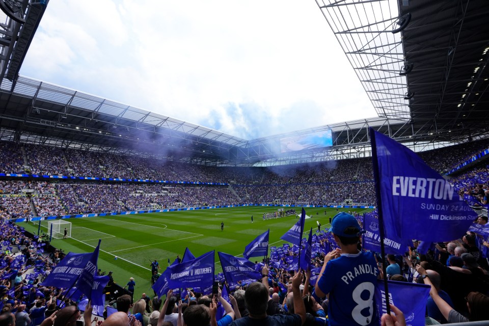 A full stadium at a soccer game kickoff.