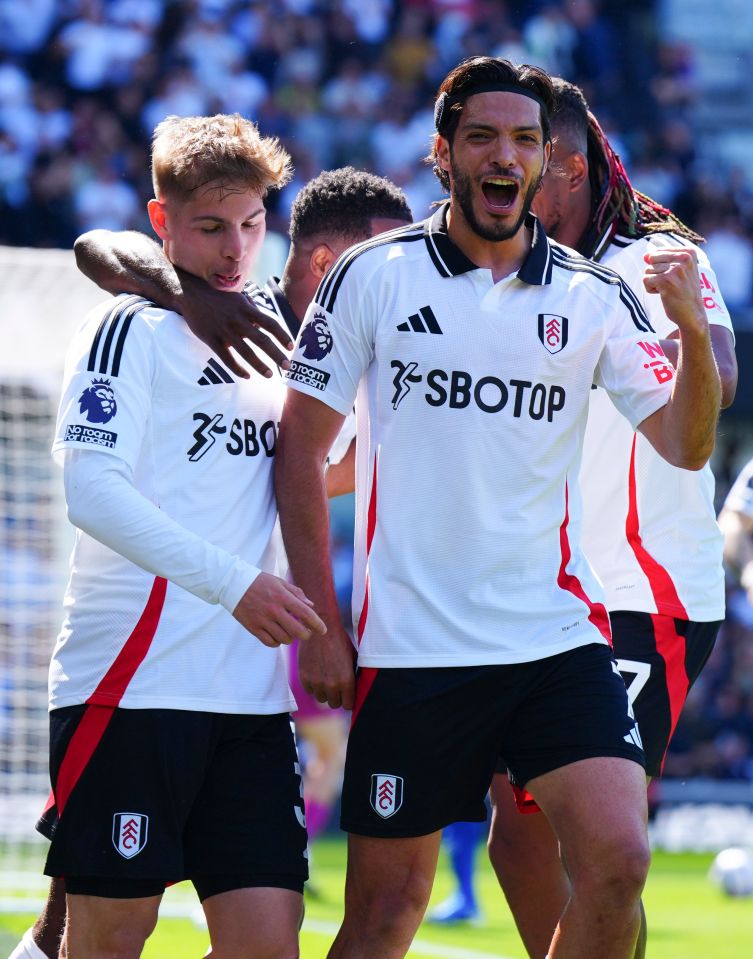 Fulham players celebrating a goal.