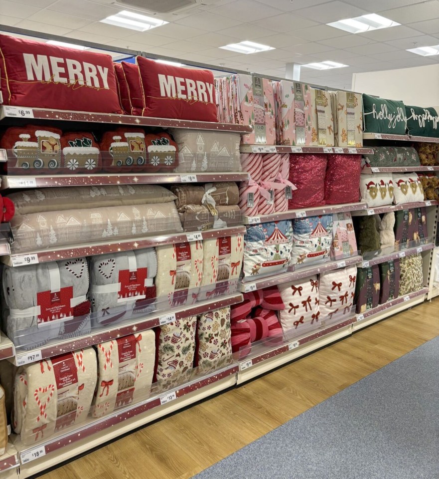 Christmas bedding and pillows on display.