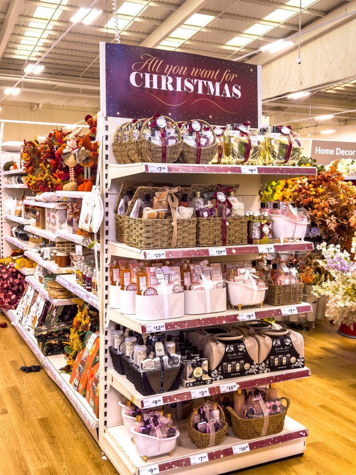 Christmas and Halloween merchandise on display in a store.