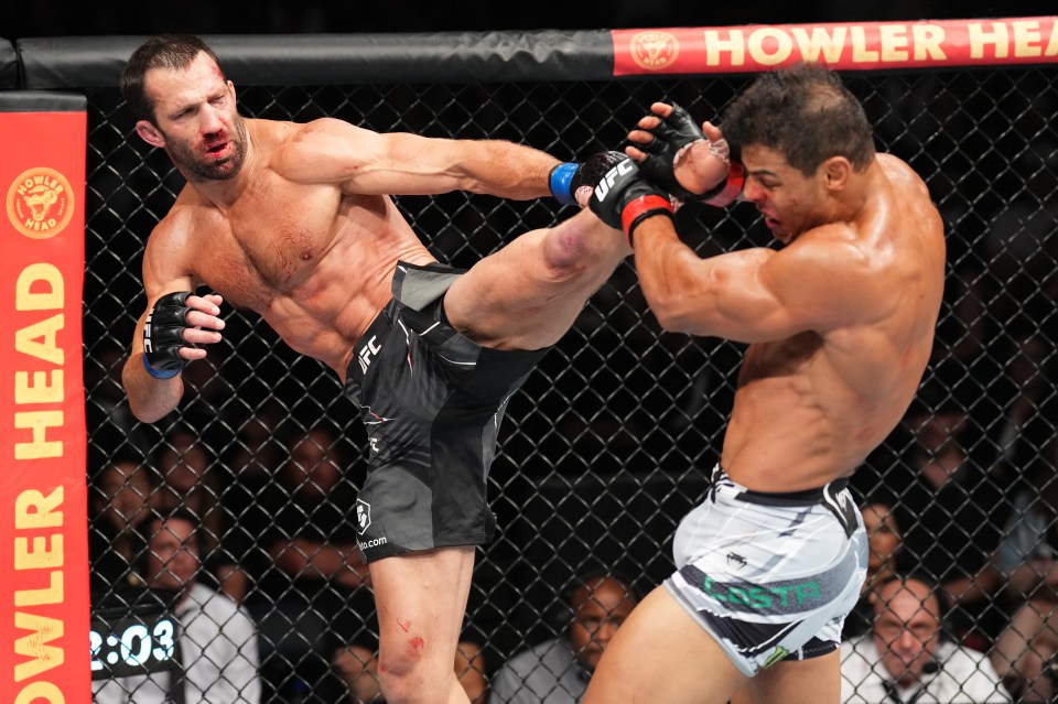 SALT LAKE CITY, UTAH - AUGUST 20: (L-R) Luke Rockhold kicks Paulo Costa of Brazil in a middleweight fight during the UFC 278 event at Vivint Arena on August 20, 2022 in Salt Lake City, Utah. (Photo by Josh Hedges/Zuffa LLC)