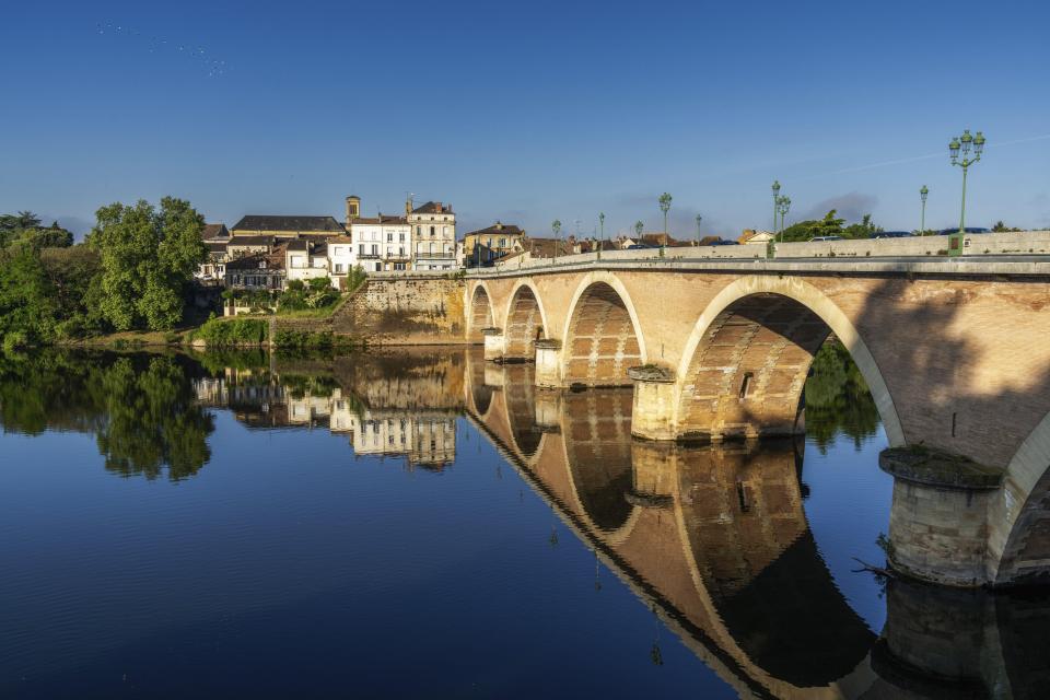 Stone bridge over the Dordogne River in Bergerac, France.
