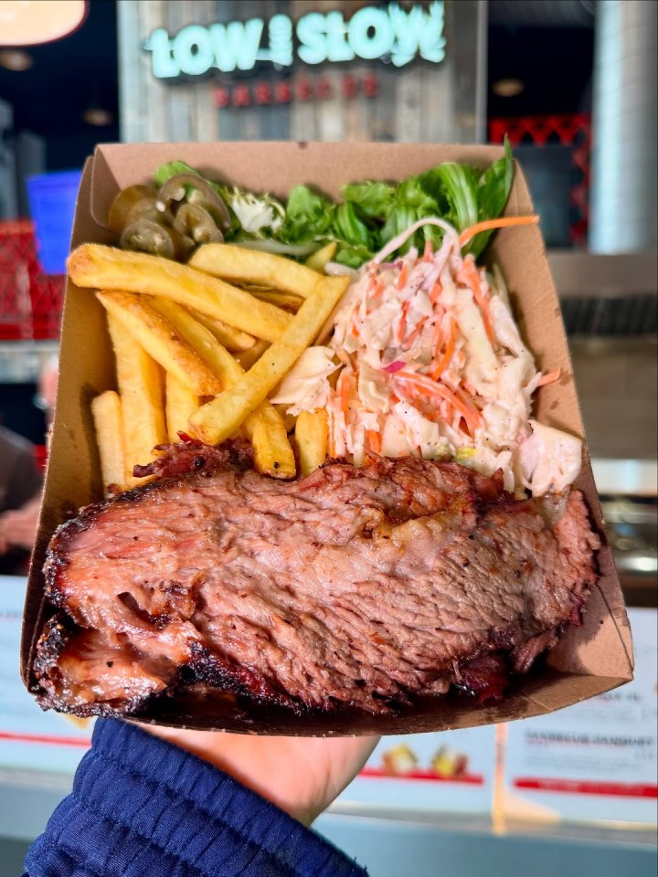 BBQ brisket with fries, coleslaw, and jalapeños.