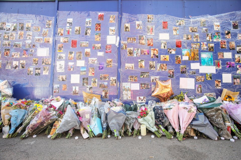 Floral tributes and photos at a memorial for Natasha.