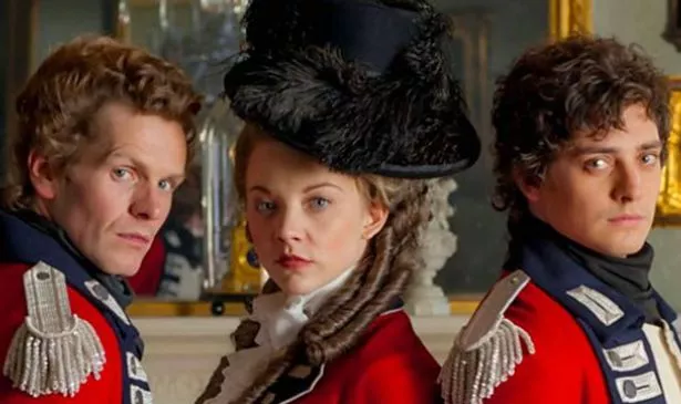 A woman and two men in red look serious
