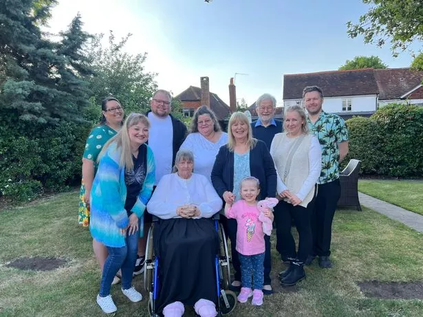 Jean with daughter Cathy (to Jean's right) together with family at their reunion