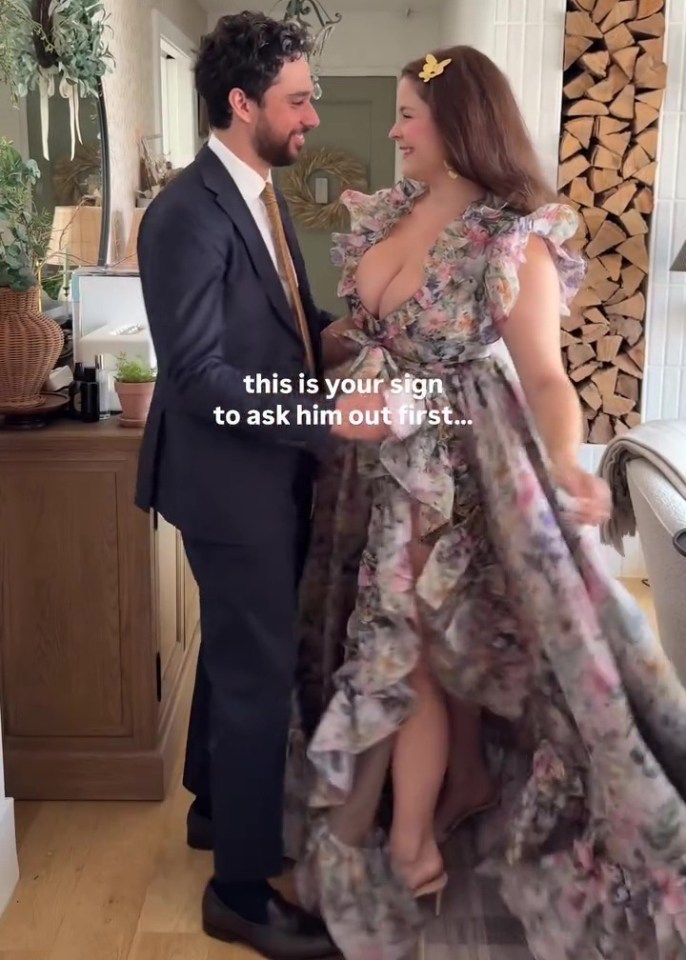 Woman in floral dress and man in suit.  Text overlay: "this is your sign to ask him out first..."