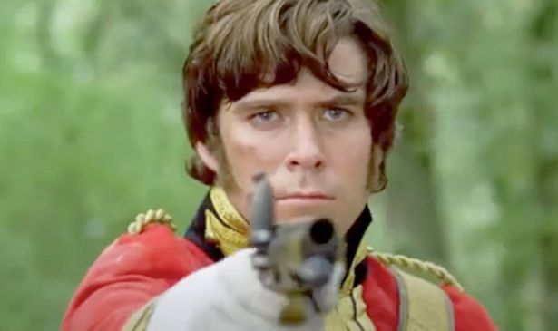 A man holds up a musket