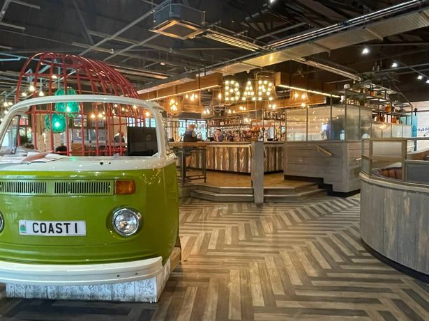 Inside a restaurants with a camper van table at the front