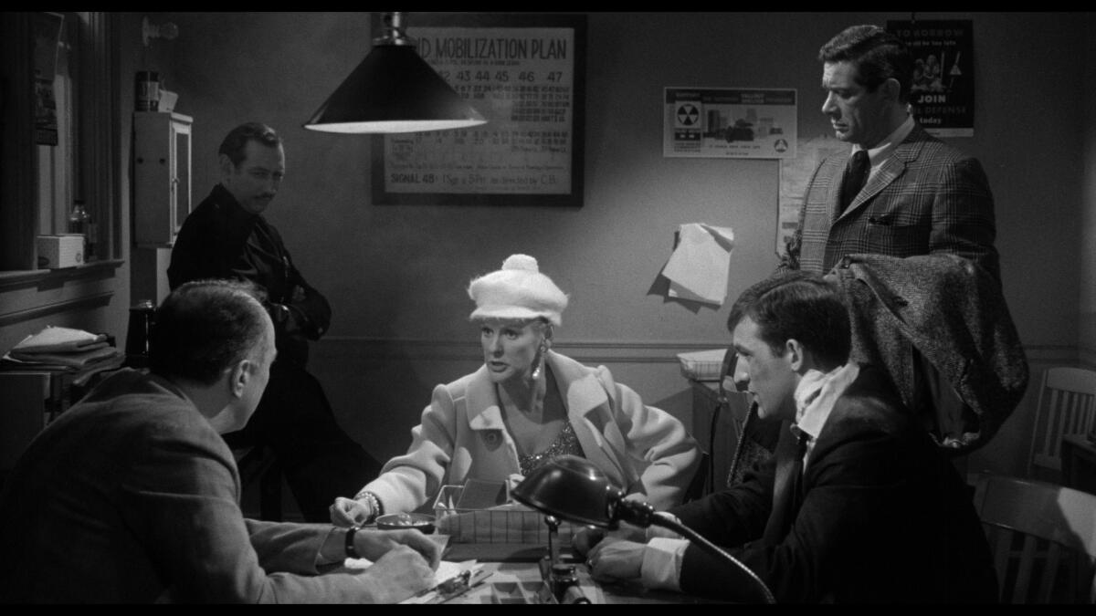 A woman in a white hat is in charge.