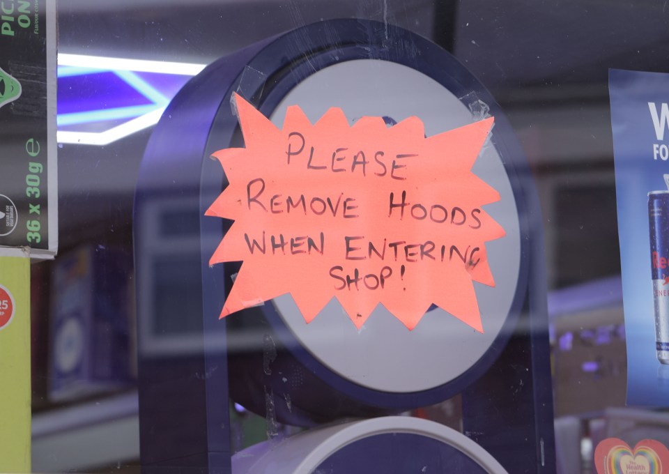 Shop sign: Remove hoods when entering.