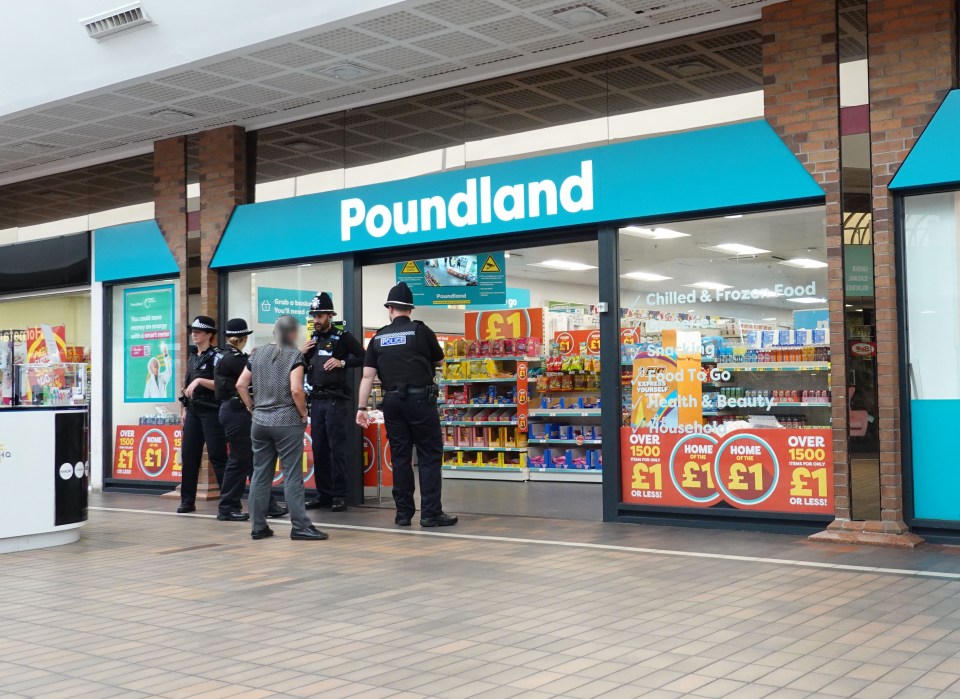 Police officers outside a Poundland store.