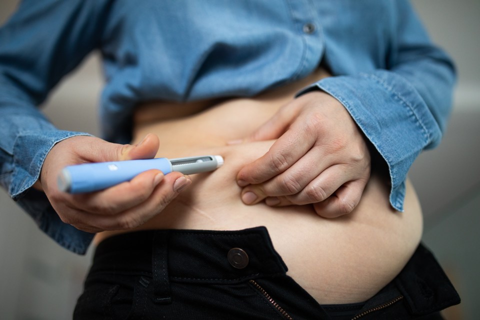 Close-up of a person injecting semaglutide into their abdomen.