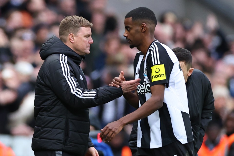 Alexander Isak of Newcastle United shaking hands with Eddie Howe, the team's head coach.