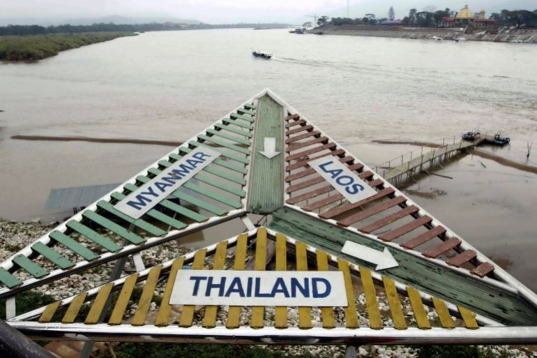 A signboard at the Thai village of Sop Ruak on the Mekong river in the Golden Triangle region where the borders of Thailand, Laos and Myanmar meet January 14, 2012. The murder of 13 Chinese sailors last October on the Mekong was the deadliest attack on Chinese nationals overseas in modern times and highlights the growing presence of China in the Golden Triangle, the opium-growing region straddling Myanmar, Laos and Thailand. Picture taken January 14, 2012. To match Special Report MEKONG-CHINA/MURDERS REUTERS/Sukree Sukplang (THAILAND - Tags: CIVIL UNREST MARITIME POLITICS BUSINESS)