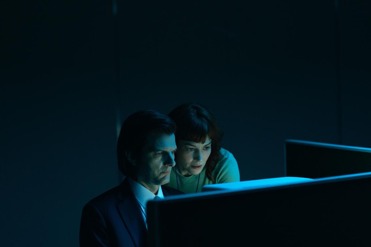 Adam Scott and Britt Lower in "Severance."