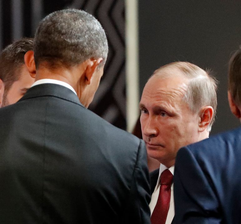 FILE - In this Nov. 20, 2016 file photo, President Barack Obama talks with Russia's President Vladimir Putin at the opening session of the Asia-Pacific Economic Cooperation (APEC) in Lima, Peru. When U.S. and Russian presidents meet, the rest of the world stops to watch. For decades, summits between leaders of the world powers have been heavily anticipated affairs in which every word, handshake and facial expression is scrutinized. (AP Photo/Pablo Martinez Monsivais, File)