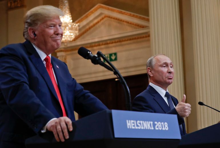 FILE - Russian President Vladimir Putin, right, and U.S. President Donald Trump give a joint news conference at the Presidential Palace in Helsinki, Finland, July 16, 2018. (AP Photo/Pablo Martinez Monsivais, File)