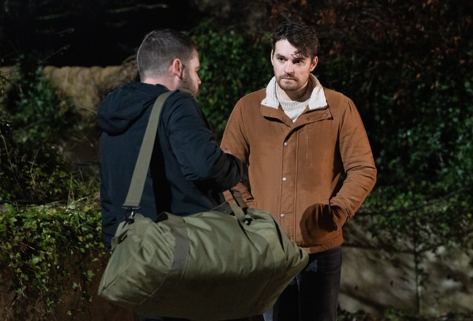 Still image from Emmerdale showing Mackenzie Boyd and Aaron Dingle talking.