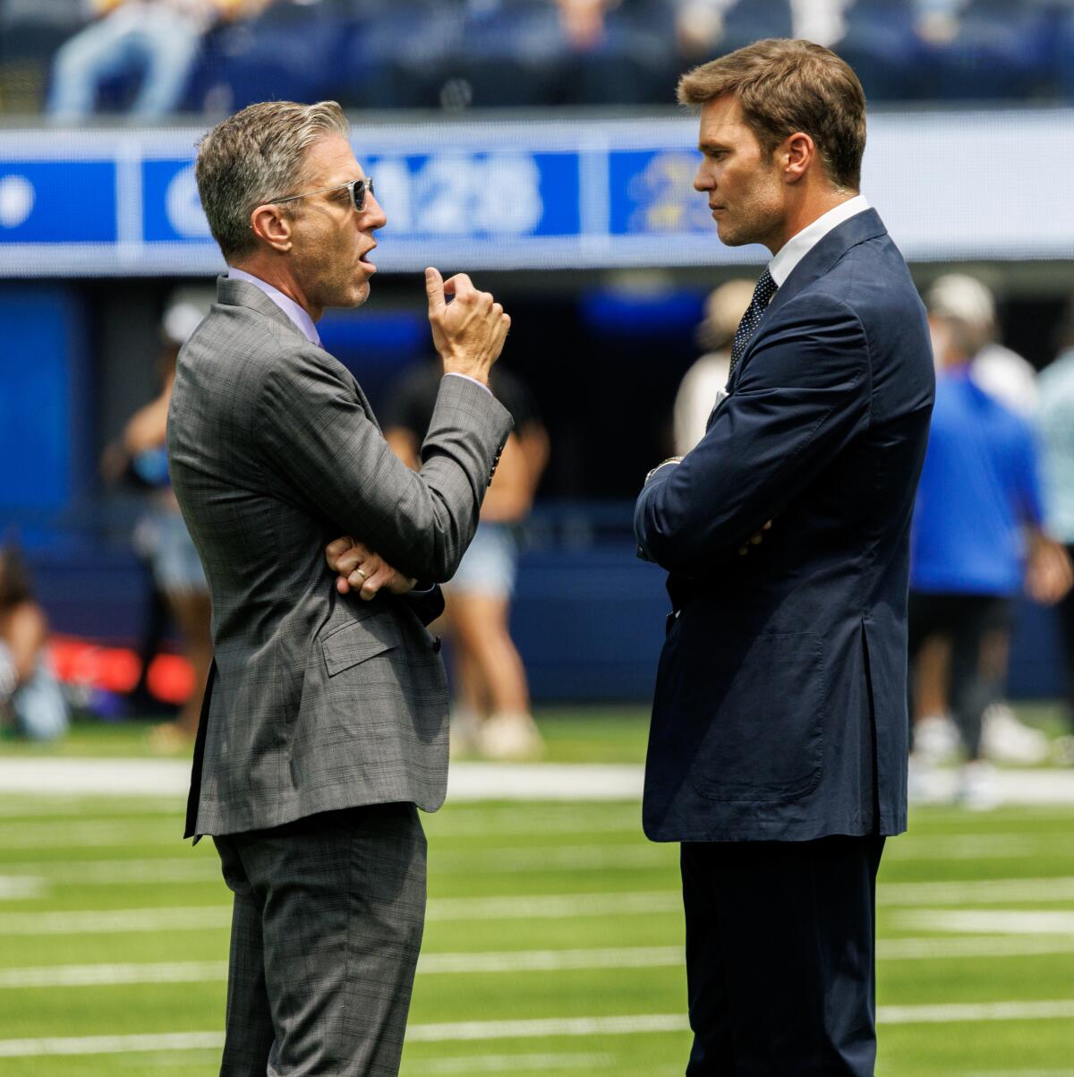 Fox Sports' Kevin Burkhardt talks with NFL broadcast partner Tom Brady before a 2024 preseason game at So-Fi Stadium.