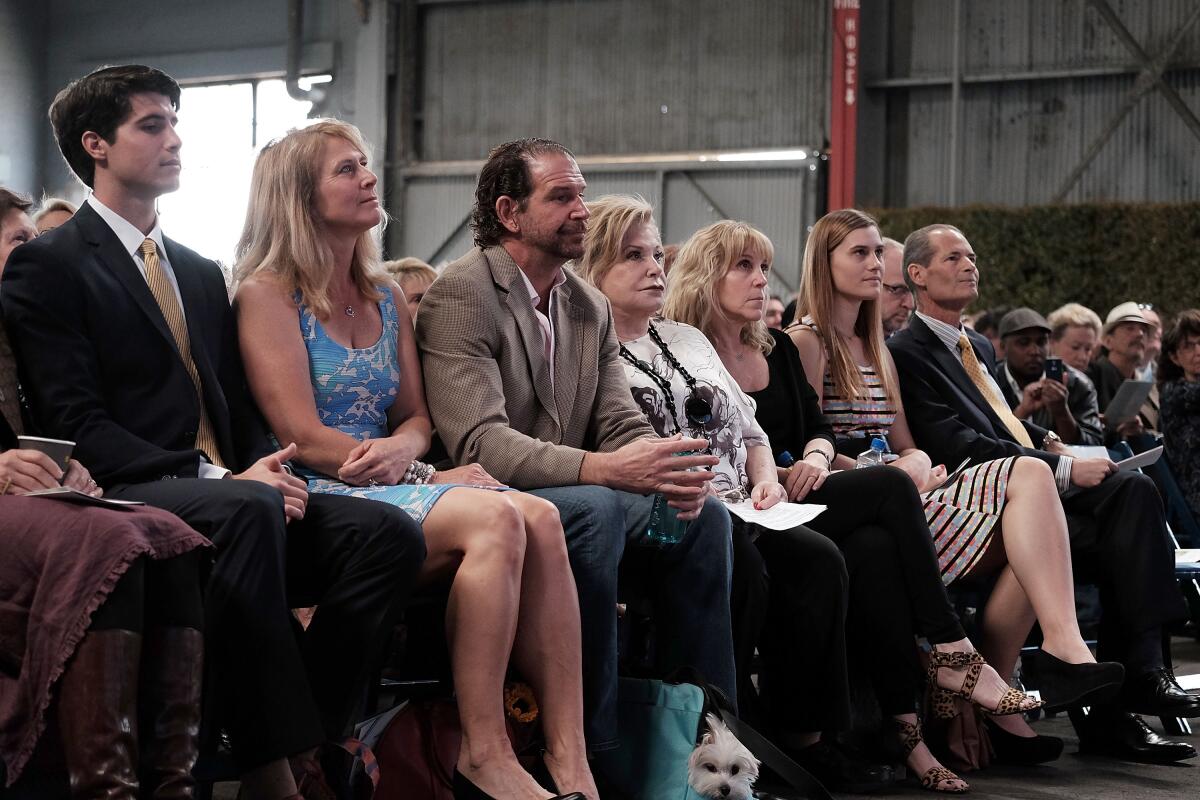 People sit in an audience.