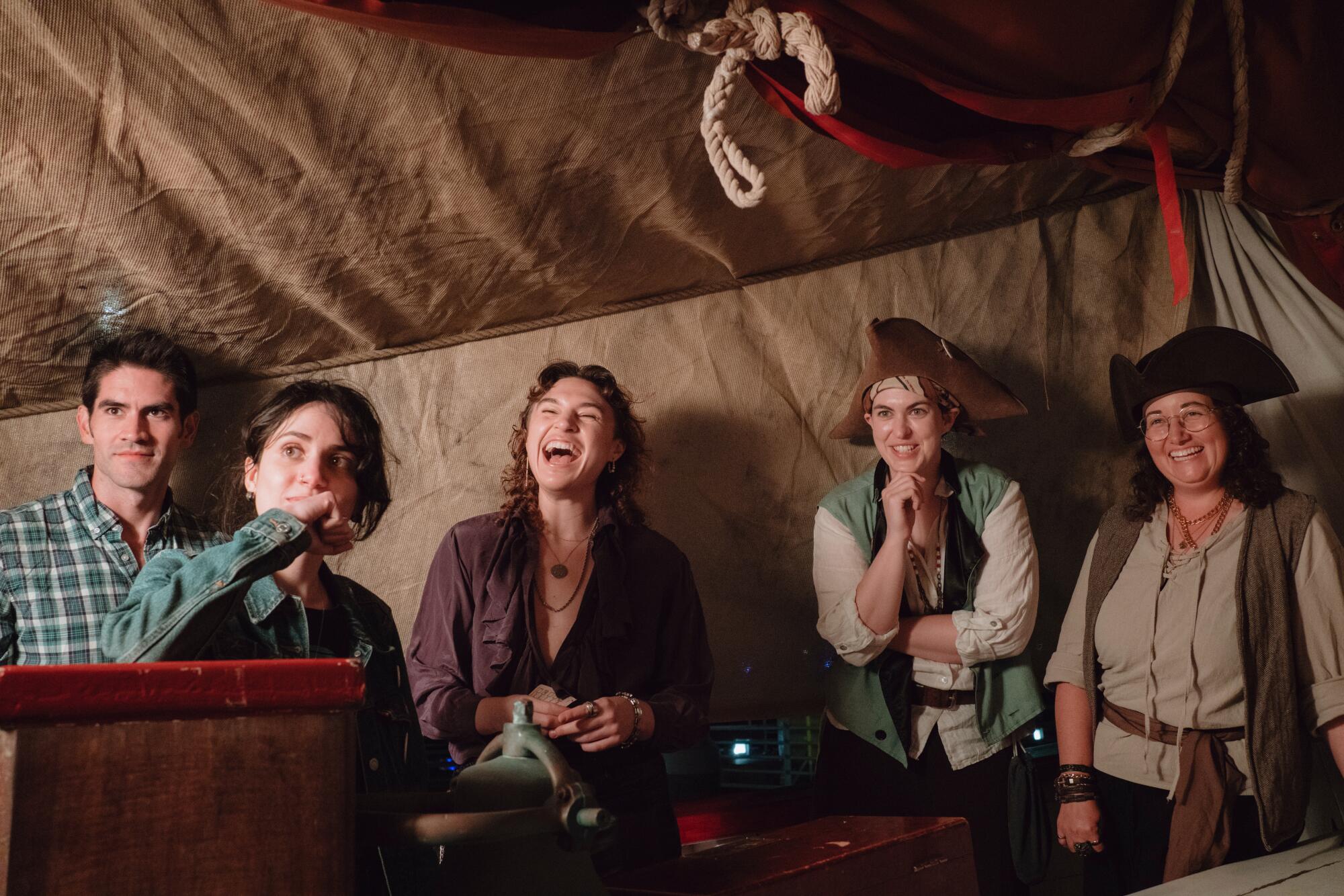 Five audience members in a jovial mood.