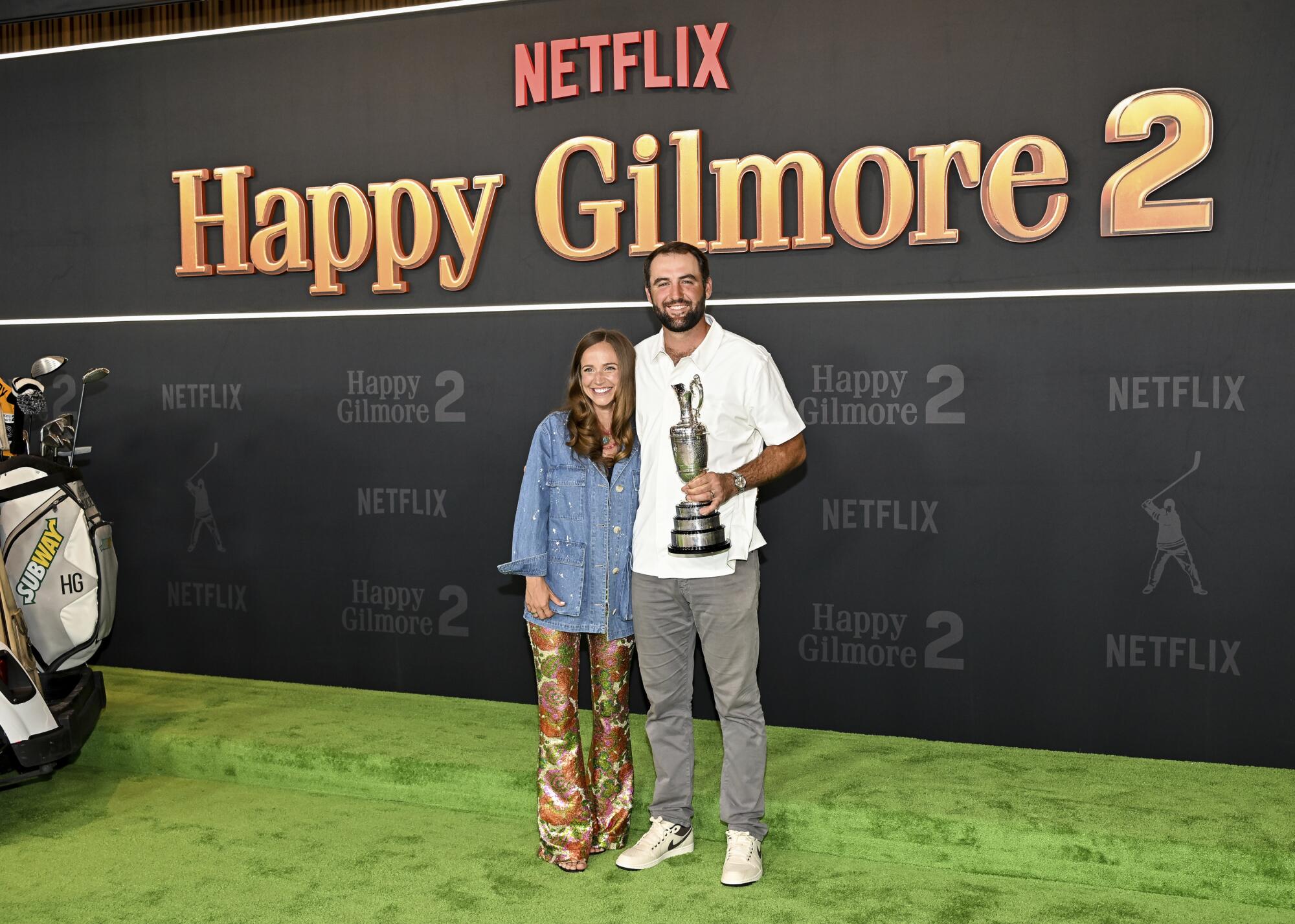 Scottie Scheffler, right, and wife Meredith Scudder pose for a photo at the premiere of Netflix's "Happy Gilmore 2."