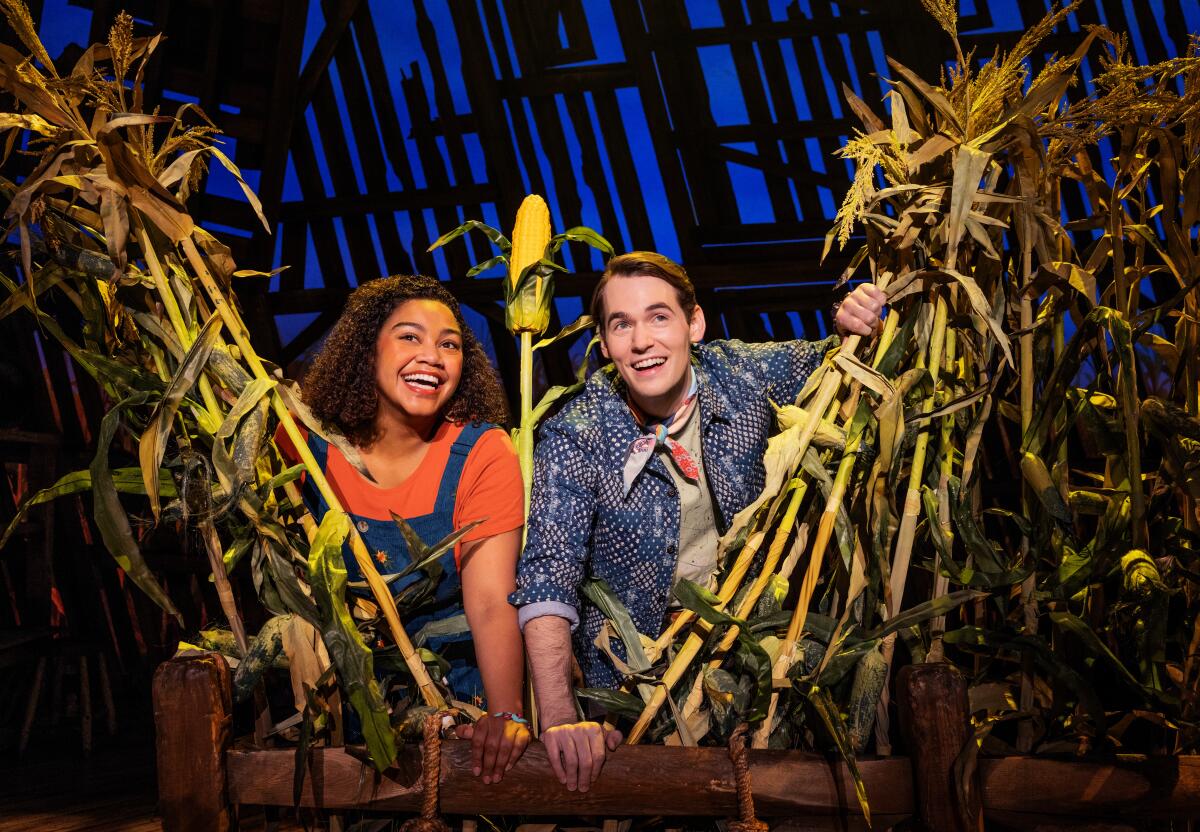 Maya Lagerstam as Storyteller 1, left, and Tyler Joseph Ellis as Storyteller 2 in the North American Tour of "Shucked"