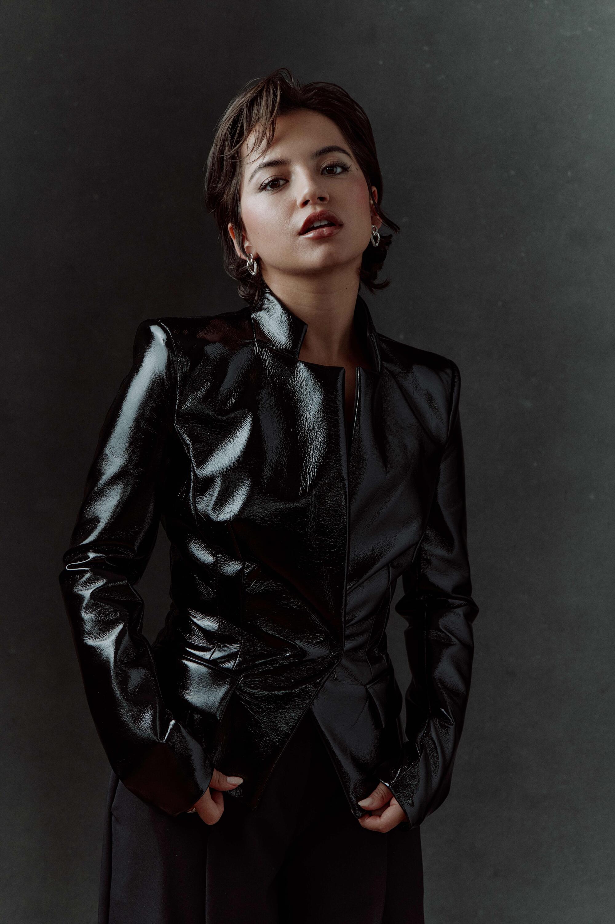 Isabela Merced dressed in black