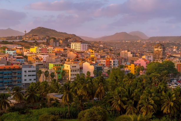 The neighborhoods of Praia, the capital of Cabo Verde, with the multi colored buildings and hilly landscape.