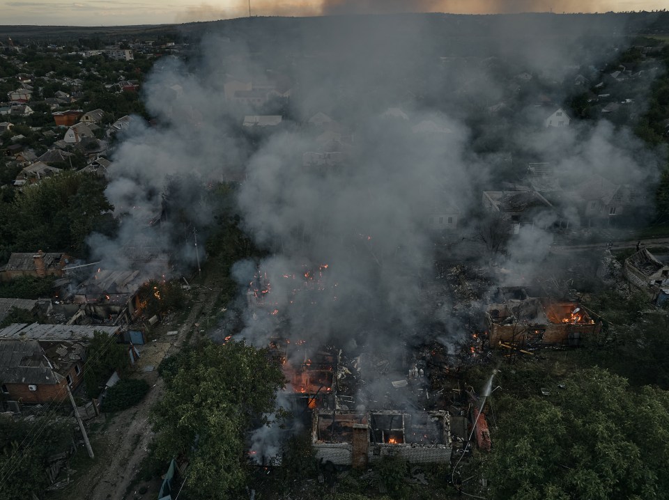 Aerial view of a residential area on fire.