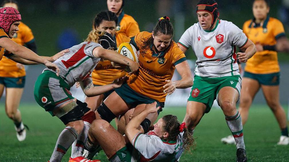Michaela Leonard carrying against Wales