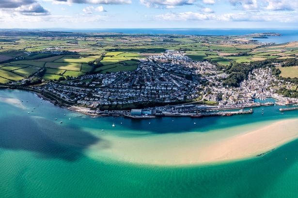 Aerial view of the town and beach of Padstow on The Camel Estuary in Cornwall, UK which is a popular vacation destination on a sunny Summer day