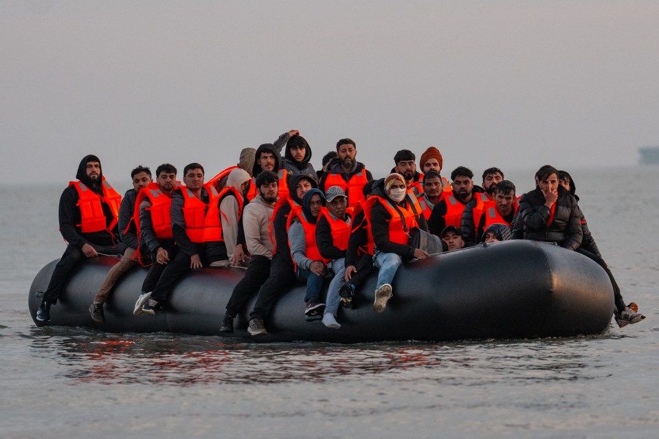 Migrants in a small boat crossing the English Channel.