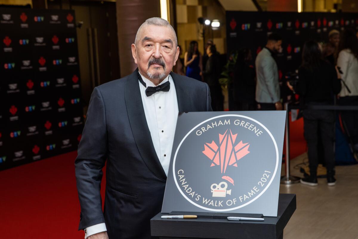 TORONTO, ONTARIO - DEC 03, 2022: Graham Greene at unveiling of his Canada's Walk of Fame 2021 commemorative plaque.