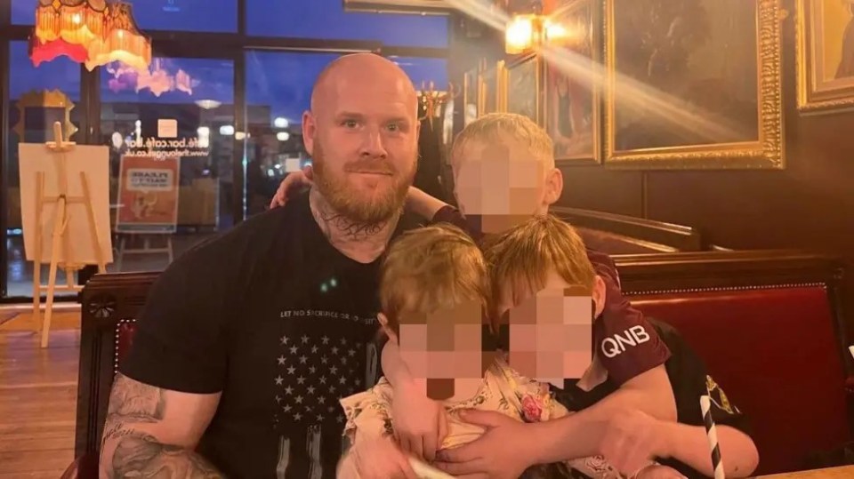 Photo of Lenny Scott with his children.